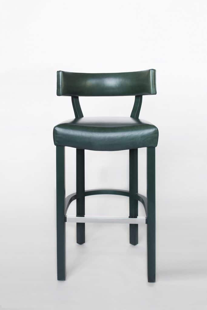 A studio product shot of a dark green bar stool on a white background.